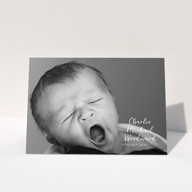 A baby card design called "1 Photo Full". It is an A5 card in a landscape orientation. It is a photographic baby card with room for 1 photo. "1 Photo Full" is available as a folded card, with mainly white colouring.