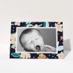 A baby card design titled "Bedtime Garden". It is an A6 card in a landscape orientation. It is a photographic baby card with room for 1 photo. "Bedtime Garden" is available as a folded card, with tones of navy blue, pink and orange.