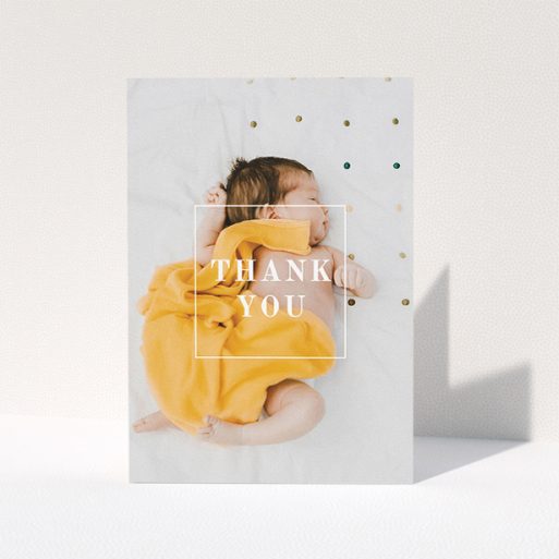 Baby Thank You Card Design - "Central Thanks" A baby thank you card called "Central Thanks". It is an A5 card in a portrait orientation. It is a photographic baby thank you card with room for 1 photo. "Central Thanks" is available as a folded card, with mainly white colouring.