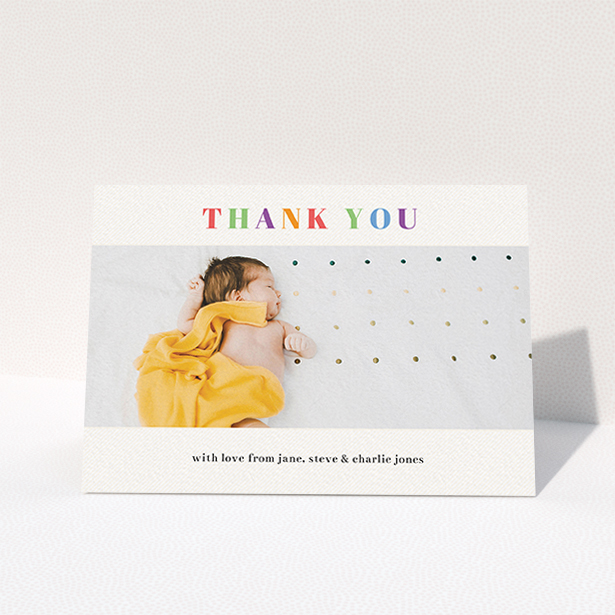 A baby thank you card named "Colourful Thanks". It is an A6 card in a landscape orientation. It is a photographic baby thank you card with room for 1 photo. "Colourful Thanks" is available as a folded card, with tones of white and green.
