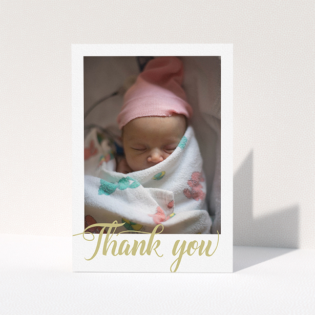 A baby thank you card design called "Golden Thank You". It is an A5 card in a portrait orientation. It is a photographic baby thank you card with room for 1 photo. "Golden Thank You" is available as a folded card, with tones of white and gold.