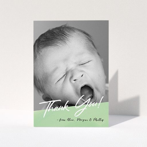 Baby Thank You Card Design - "Green Slant" A baby thank you card design titled "Green Slant". It is an A6 card in a portrait orientation. It is a photographic baby thank you card with room for 1 photo. "Green Slant" is available as a folded card, with mainly green colouring.