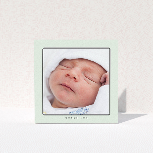 A baby thank you card called "Mint Deco". It is a square (148mm x 148mm) card in a square orientation. It is a photographic baby thank you card with room for 1 photo. "Mint Deco" is available as a folded card, with mainly green colouring.