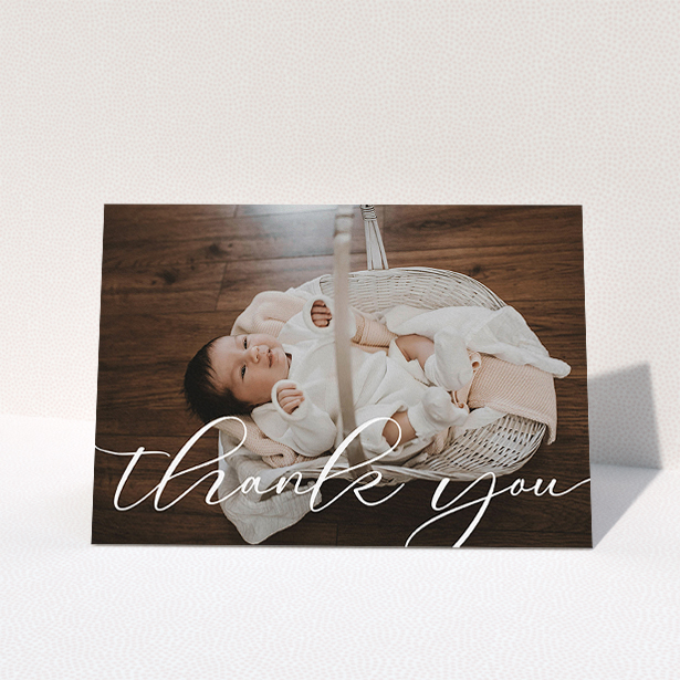 A baby thank you card design called "One Photo". It is an A5 card in a landscape orientation. It is a photographic baby thank you card with room for 1 photo. "One Photo" is available as a folded card, with mainly white colouring.
