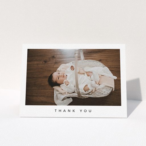 Baby Thank You Card Design - "Simple" A baby thank you card design named "Simple". It is an A6 card in a landscape orientation. It is a photographic baby thank you card with room for 1 photo. "Simple" is available as a folded card, with mainly white colouring.