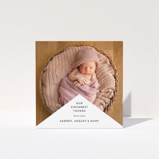 Baby Thank You Card Design - "Wedge Frame" A baby thank you card called "Wedge Frame". It is a square (148mm x 148mm) card in a square orientation. It is a photographic baby thank you card with room for 1 photo. "Wedge Frame" is available as a folded card, with mainly white colouring.