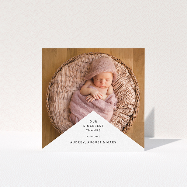 A baby thank you card called "Wedge Frame". It is a square (148mm x 148mm) card in a square orientation. It is a photographic baby thank you card with room for 1 photo. "Wedge Frame" is available as a folded card, with mainly white colouring.