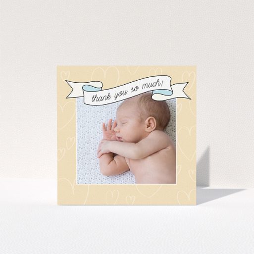 Thank You Card - Written Above (Baby Boy) A baby thank you card called "Written Above". It is a square (148mm x 148mm) card in a square orientation. It is a photographic baby thank you card with room for 1 photo. "Written Above" is available as a folded card, with tones of faded yellow and light blue.
