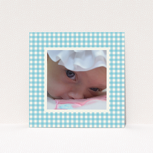 A baptism invitation called "Blue Plaid". It is a square (148mm x 148mm) invite card in a square orientation. It is a photographic baptism invitation with room for 1 photo. "Blue Plaid" is available as a flat invite card, with tones of blue and white.