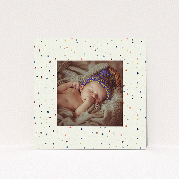 A baptism invitation named "Dot-dot-dot". It is a square (148mm x 148mm) invite card in a square orientation. It is a photographic baptism invitation with room for 1 photo. "Dot-dot-dot" is available as a flat invite card, with mainly cream colouring.