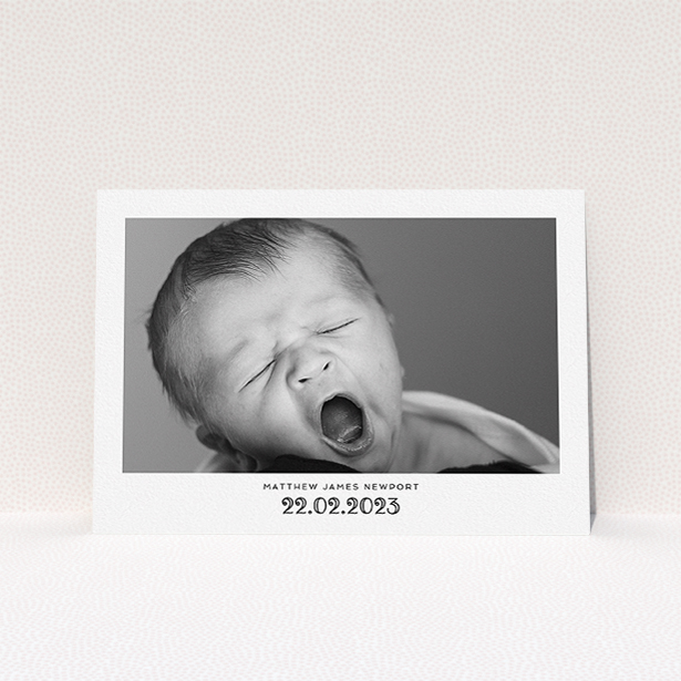 A baptism invitation called "Ornate Date". It is an A5 invite card in a landscape orientation. It is a photographic baptism invitation with room for 1 photo. "Ornate Date" is available as a flat invite card, with mainly white colouring.
