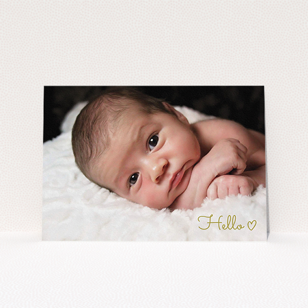 A baptism invitation design called "We say hello". It is an A5 invite card in a landscape orientation. It is a photographic baptism invitation with room for 1 photo. "We say hello" is available as a flat invite card, with mainly gold colouring.