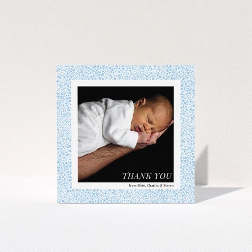 Baptism Thank You Card Design - "Blue Floral Frame" A baptism thank you card template titled "Blue Floral Frame". It is a square (148mm x 148mm) card in a square orientation. It is a photographic baptism thank you card with room for 1 photo. "Blue Floral Frame" is available as a folded card, with tones of blue and white.