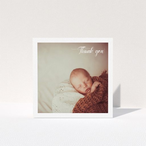 Baptism Thank You Card Design - "Central Square Frame" A baptism thank you card named "Central Square Frame". It is a square (148mm x 148mm) card in a square orientation. It is a photographic baptism thank you card with room for 1 photo. "Central Square Frame" is available as a folded card, with mainly white colouring.