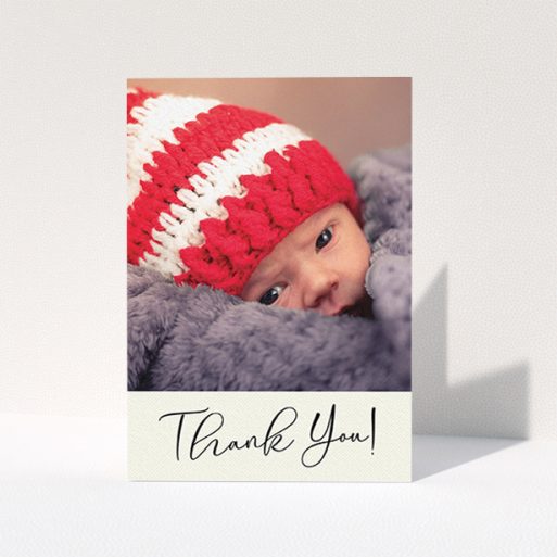 Baptism Thank You Card Design - "Cursive Thanks" A baptism thank you card design titled "Cursive Thanks". It is an A6 card in a portrait orientation. It is a photographic baptism thank you card with room for 1 photo. "Cursive Thanks" is available as a folded card, with mainly cream colouring.