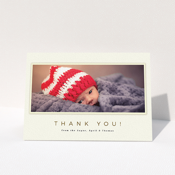 A baptism thank you card design named "Torn Cream Frame". It is an A6 card in a landscape orientation. It is a photographic baptism thank you card with room for 1 photo. "Torn Cream Frame" is available as a folded card, with mainly cream colouring.