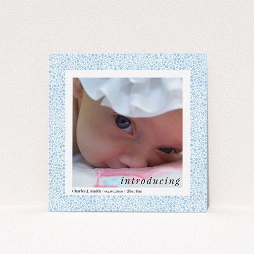 Birth Announcement Card Design - "Baby Blue Floral" A birth announcement card design titled "Baby Blue Floral". It is a square (148mm x 148mm) card in a square orientation. It is a photographic birth announcement card with room for 1 photo. "Baby Blue Floral" is available as a flat card, with tones of blue and white.