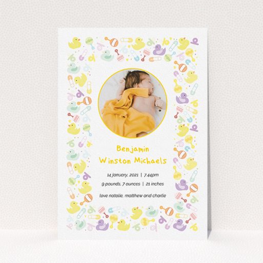 Birth Announcement Card Design - "In the Playroom" A birth announcement card called "In the Playroom". It is an A5 card in a portrait orientation. It is a photographic birth announcement card with room for 1 photo. "In the Playroom" is available as a flat card, with tones of yellow, white and light purple.