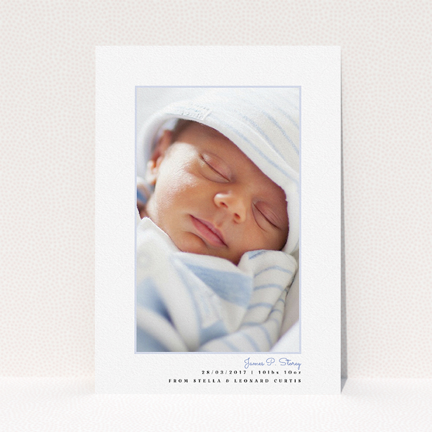 A birth announcement card named "Little Blue Frame". It is an A5 card in a portrait orientation. It is a photographic birth announcement card with room for 1 photo. "Little Blue Frame" is available as a flat card, with tones of white and blue.