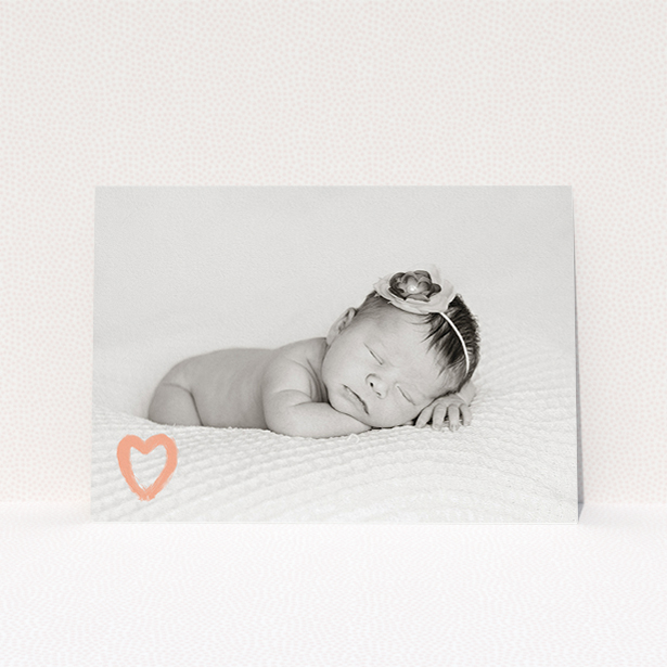 A birth announcement card design called "Pastel Heart". It is an A5 card in a landscape orientation. It is a photographic birth announcement card with room for 1 photo. "Pastel Heart" is available as a flat card, with mainly peach colouring.