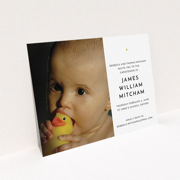 A christening invitation design named "Baby Cross". It is an A6 invite in a landscape orientation. It is a photographic christening invitation with room for 1 photo. "Baby Cross" is available as a flat invite, with tones of white and gold.