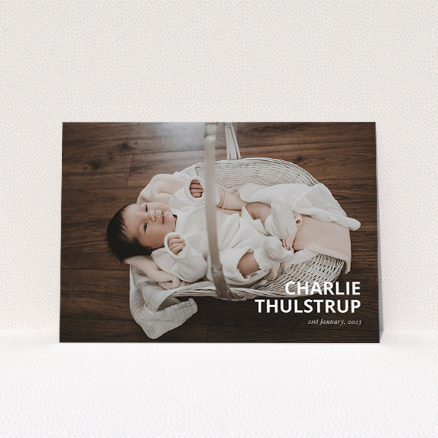 A christening invitation named "Bold Corner Photo". It is an A5 invite in a landscape orientation. It is a photographic christening invitation with room for 1 photo. "Bold Corner Photo" is available as a flat invite, with mainly white colouring.