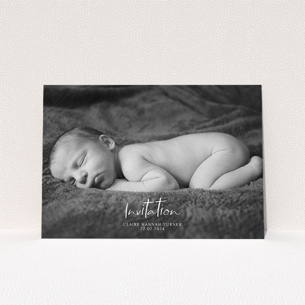 A christening invitation template titled "Central Script". It is an A5 invite in a landscape orientation. It is a photographic christening invitation with room for 1 photo. "Central Script" is available as a flat invite, with mainly white colouring.