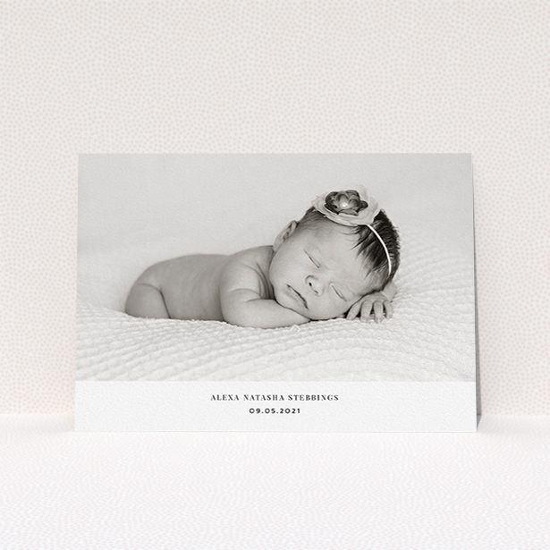 A christening invitation named "Duke of York Square". It is an A5 invite in a landscape orientation. It is a photographic christening invitation with room for 1 photo. "Duke of York Square" is available as a flat invite, with mainly white colouring.