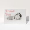 A christening thank you card design called "Big Thanks". It is an A5 card in a landscape orientation. It is a photographic christening thank you card with room for 1 photo. "Big Thanks" is available as a folded card, with mainly light pink colouring.