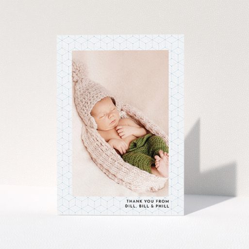 Christening Thank You Card Design - "Isometric Frame" A christening thank you card called "Isometric Frame". It is an A6 card in a portrait orientation. It is a photographic christening thank you card with room for 1 photo. "Isometric Frame" is available as a folded card, with mainly blue colouring.