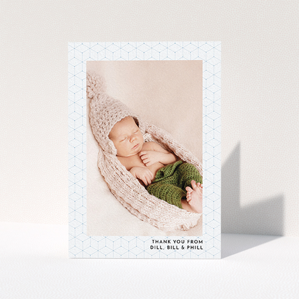 A christening thank you card called "Isometric Frame". It is an A6 card in a portrait orientation. It is a photographic christening thank you card with room for 1 photo. "Isometric Frame" is available as a folded card, with mainly blue colouring.