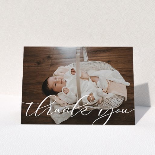 Christening Thank You Card Design - "One Photo" A christening thank you card design called "One Photo". It is an A5 card in a landscape orientation. It is a photographic christening thank you card with room for 1 photo. "One Photo" is available as a folded card, with mainly white colouring.