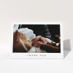 A christening thank you card template titled "Simple Thanks". It is an A6 card in a landscape orientation. It is a photographic christening thank you card with room for 1 photo. "Simple Thanks" is available as a folded card, with mainly white colouring.