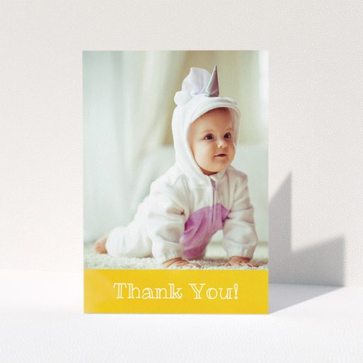 Christening Thank You Card Design - "Thanks In Yellow" A christening thank you card named "Thanks In Yellow". It is an A5 card in a portrait orientation. It is a photographic christening thank you card with room for 1 photo. "Thanks In Yellow" is available as a folded card, with tones of yellow and white.