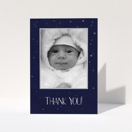 Christening Thank You Card Design - "Written in the Stars" A christening thank you card template titled "Written in the Stars". It is an A6 card in a portrait orientation. It is a photographic christening thank you card with room for 1 photo. "Written in the Stars" is available as a folded card, with tones of dark blue, white and silver.