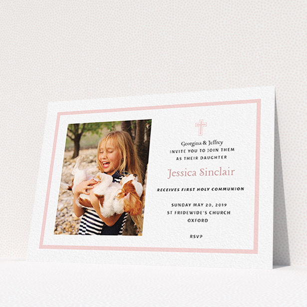 A communion invitation template titled "Baby Pink Cross". It is an A6 invite in a landscape orientation. It is a photographic communion invitation with room for 1 photo. "Baby Pink Cross" is available as a flat invite, with tones of pink and white.