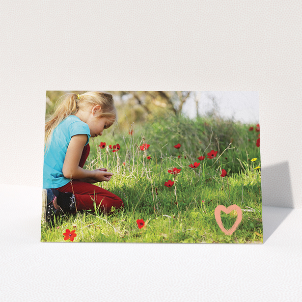 A communion thank you card called "Hand Drawn Heart". It is an A5 card in a landscape orientation. It is a photographic communion thank you card with room for 1 photo. "Hand Drawn Heart" is available as a folded card, with tones of white and pink.