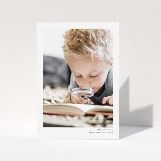 Communion Thank You Card Design - "Simple Portrait" A communion thank you card named "Simple Portrait". It is an A5 card in a portrait orientation. It is a photographic communion thank you card with room for 1 photo. "Simple Portrait" is available as a folded card, with mainly white colouring.