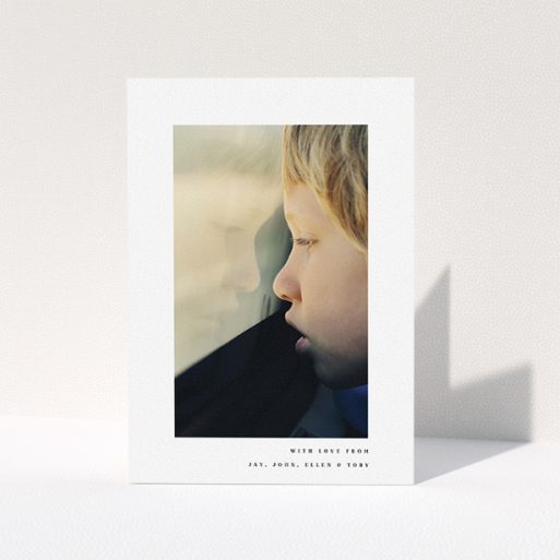 Communion Thank You Card Design - "Thin Blue Frame" A communion thank you card called "Thin Blue Frame". It is an A5 card in a portrait orientation. It is a photographic communion thank you card with room for 1 photo. "Thin Blue Frame" is available as a folded card, with mainly white colouring.