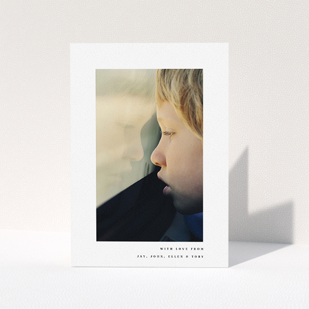 A communion thank you card called "Thin Blue Frame". It is an A5 card in a portrait orientation. It is a photographic communion thank you card with room for 1 photo. "Thin Blue Frame" is available as a folded card, with mainly white colouring.