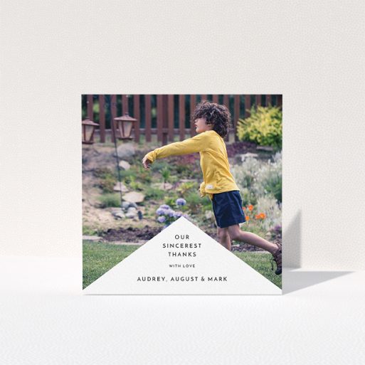 Communion Thank You Card Design - "Wedge Frame" A communion thank you card template titled "Wedge Frame". It is a square (148mm x 148mm) card in a square orientation. It is a photographic communion thank you card with room for 1 photo. "Wedge Frame" is available as a folded card, with mainly white colouring.