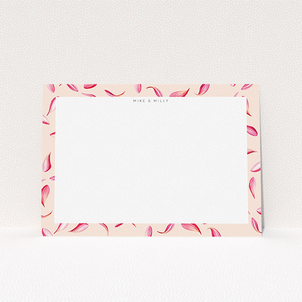 A couples custom writing stationery named "Falling petals". It is an A5 card in a landscape orientation. "Falling petals" is available as a flat card, with tones of faded yellow and light pink.