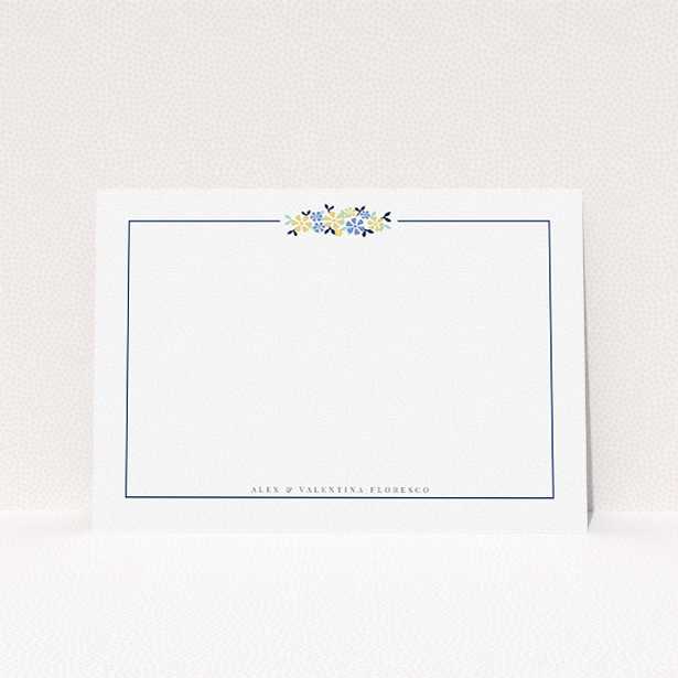 A couples personalised note card design called "Surrounded by flowers". It is an A5 card in a landscape orientation. "Surrounded by flowers" is available as a flat card, with tones of white and blue.