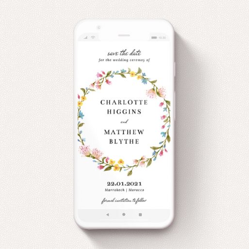 Digital Save The Date Design - "Spring Wreath" A digital save the date template titled "Spring Wreath". It is a smartphone screen sized save the date in a portrait orientation. "Spring Wreath" is available as a flat save the date, with mainly pink colouring.