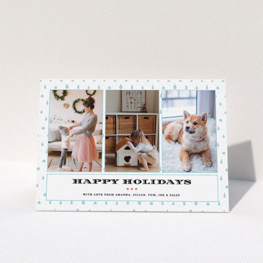 Family Christmas Card Design - "Blue Forrest" A family christmas card design titled "Blue Forrest". It is an A5 card in a landscape orientation. It is a photographic family christmas card with room for 3 photos. "Blue Forrest" is available as a folded card, with tones of blue and white.