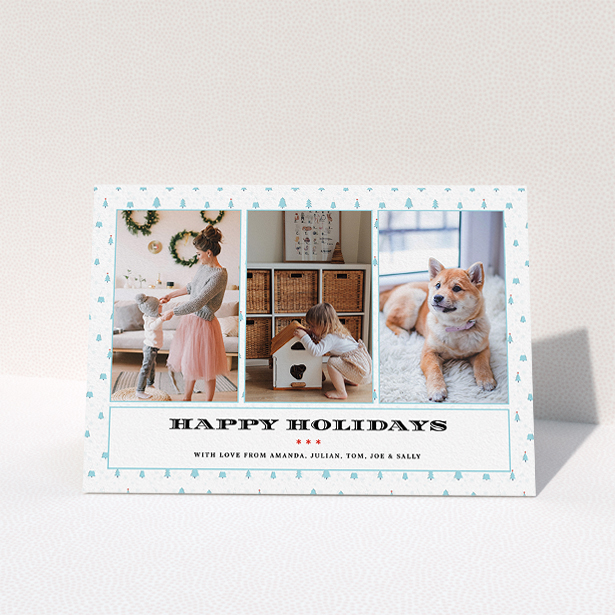 A family christmas card design titled "Blue Forrest". It is an A5 card in a landscape orientation. It is a photographic family christmas card with room for 3 photos. "Blue Forrest" is available as a folded card, with tones of blue and white.