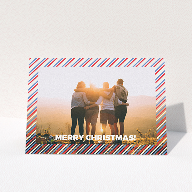 A family christmas card called "Bold Christmas Border". It is an A6 card in a landscape orientation. It is a photographic family christmas card with room for 1 photo. "Bold Christmas Border" is available as a folded card, with mainly white colouring.