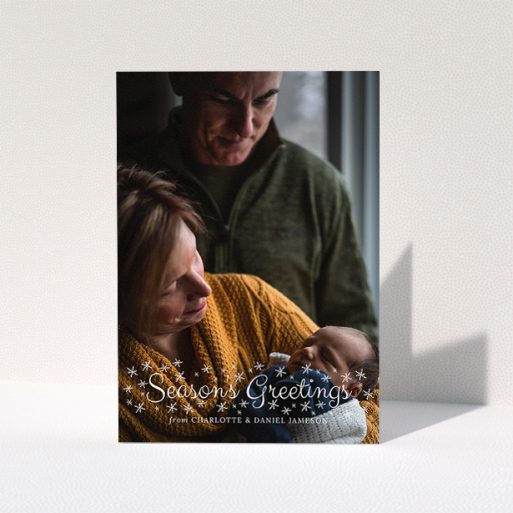 Family Christmas Card Design - "Sparkling Snow" A family christmas card template titled "Sparkling Snow". It is an A5 card in a portrait orientation. It is a photographic family christmas card with room for 1 photo. "Sparkling Snow" is available as a folded card, with mainly white colouring.