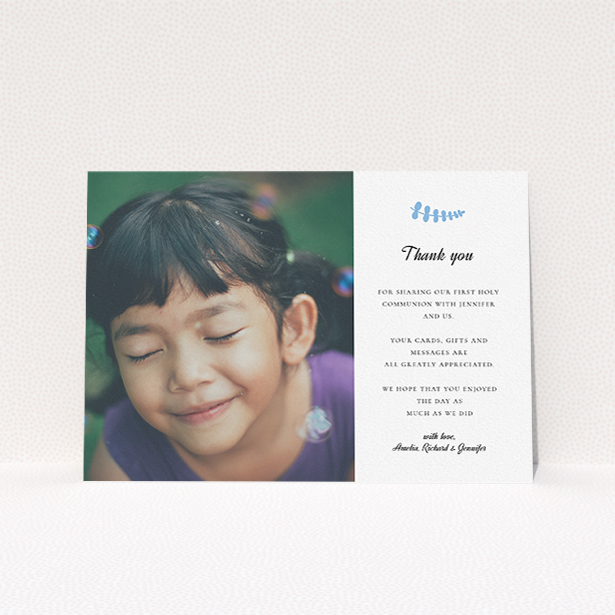 A first holy communion thank you card called "Blue Fern". It is an A5 card in a landscape orientation. It is a photographic first holy communion thank you card with room for 1 photo. "Blue Fern" is available as a flat card, with tones of white and blue.