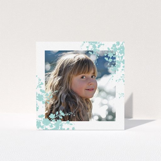 First Holy Communion Thank You Card Design - "Blue Forest Corners" A first holy communion thank you card called "Blue Forest Corners". It is a square (148mm x 148mm) card in a square orientation. It is a photographic first holy communion thank you card with room for 1 photo. "Blue Forest Corners" is available as a folded card, with tones of green and white.